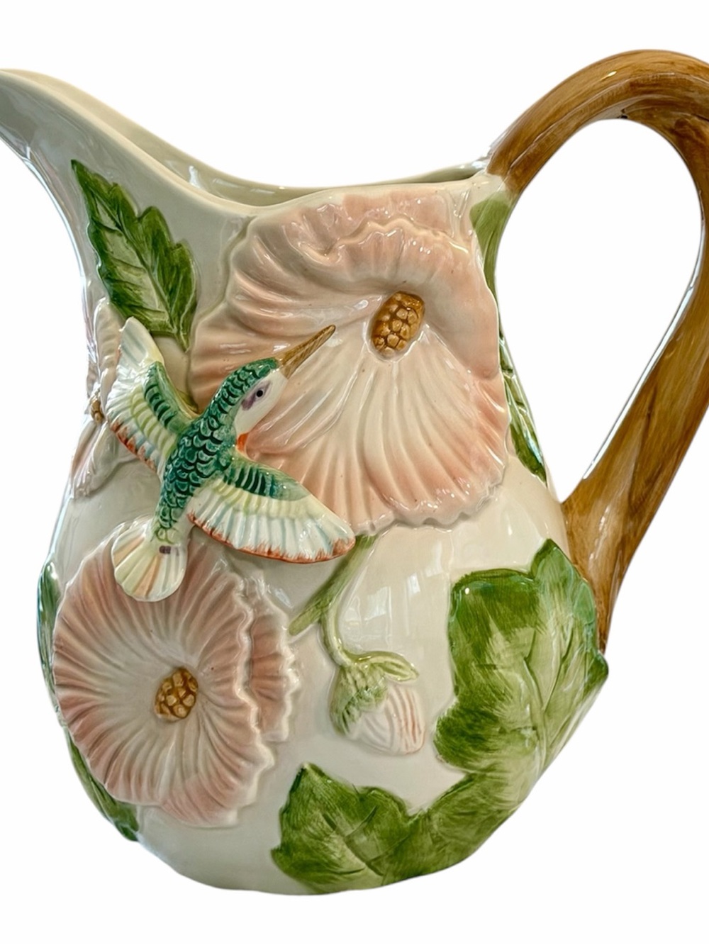 This is a 1987 vintage Fitz and Floyd 2-quart pitcher featuring a 3D hummingbird